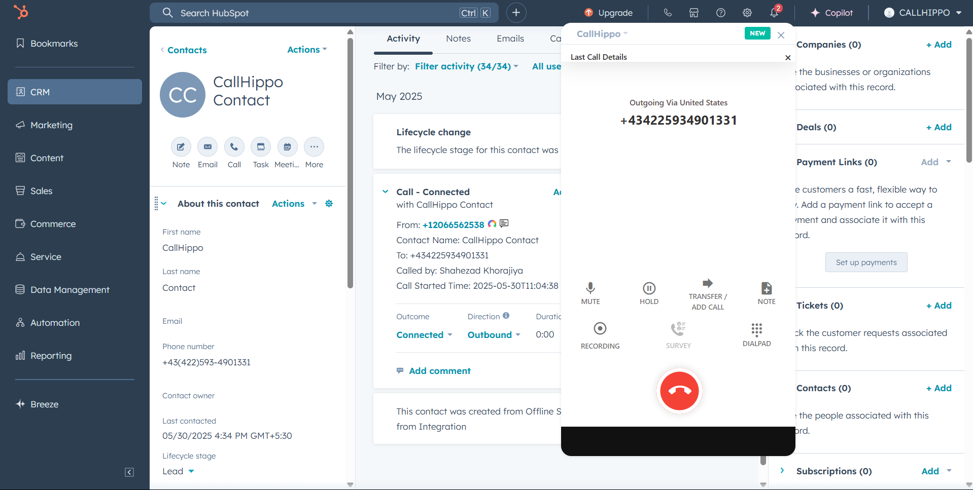 CallHippo dialer with an active outgoing call running inside HubSpot