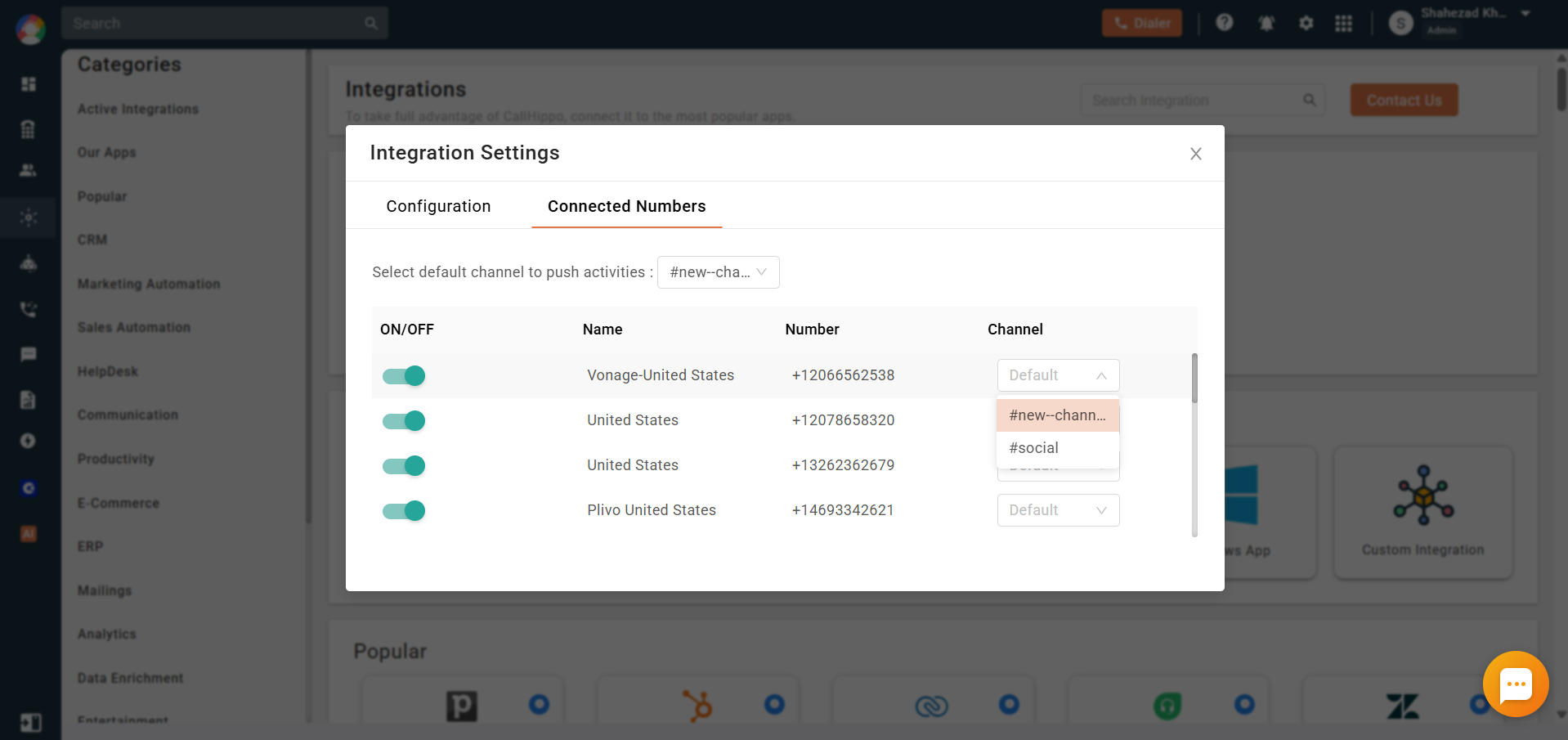 Connected Numbers tab with a channel dropdown open showing the available Slack channels