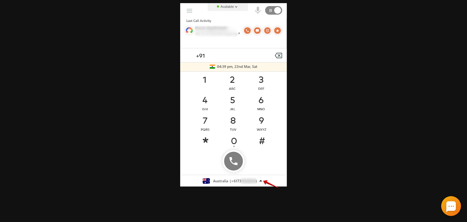 CallHippo dialer with a red arrow pointing to the number and flag dropdown at the bottom center