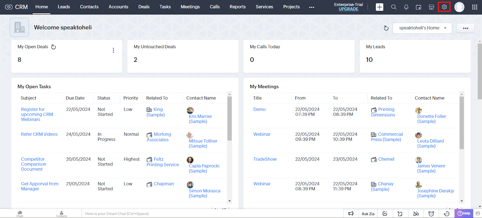 Zoho CRM home with the Settings gear icon highlighted in the top-right corner